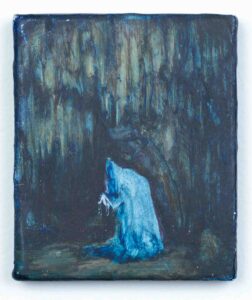 montre bleu dans une grotte recouvert d'un drap. il est luminescent, la grotte est plongé dans l'obscurité
